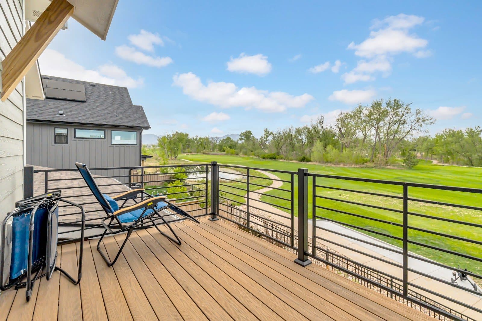 A private deck opening onto open ground with the range beyond