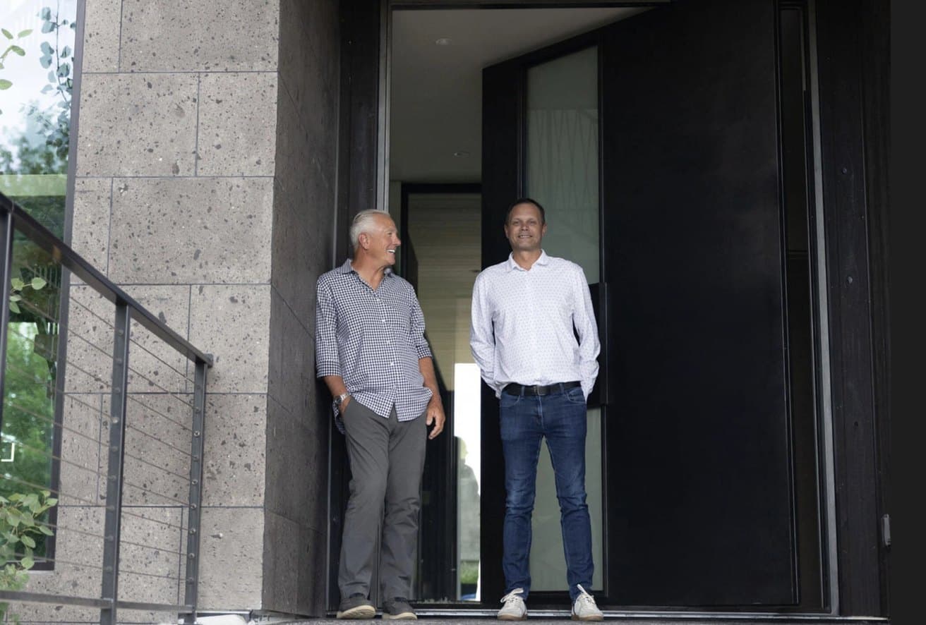 Rich Reasons and Svein Groem outside the entry of a Boulder residence.
